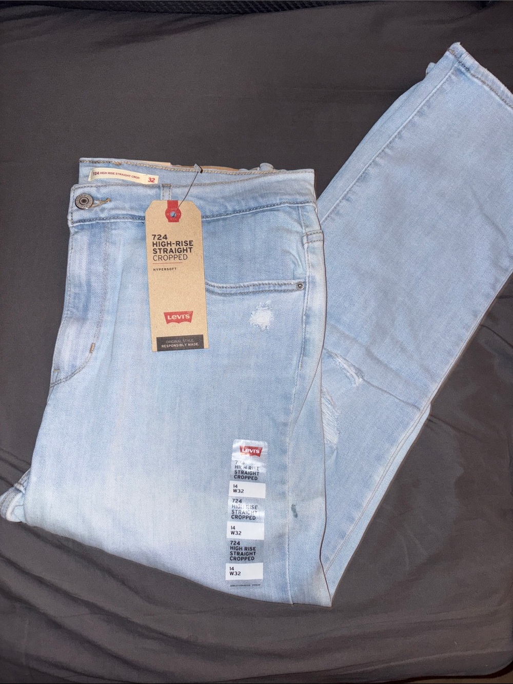 Levi's 724 high rise straight cropped jeans. Size 32. With ripped details